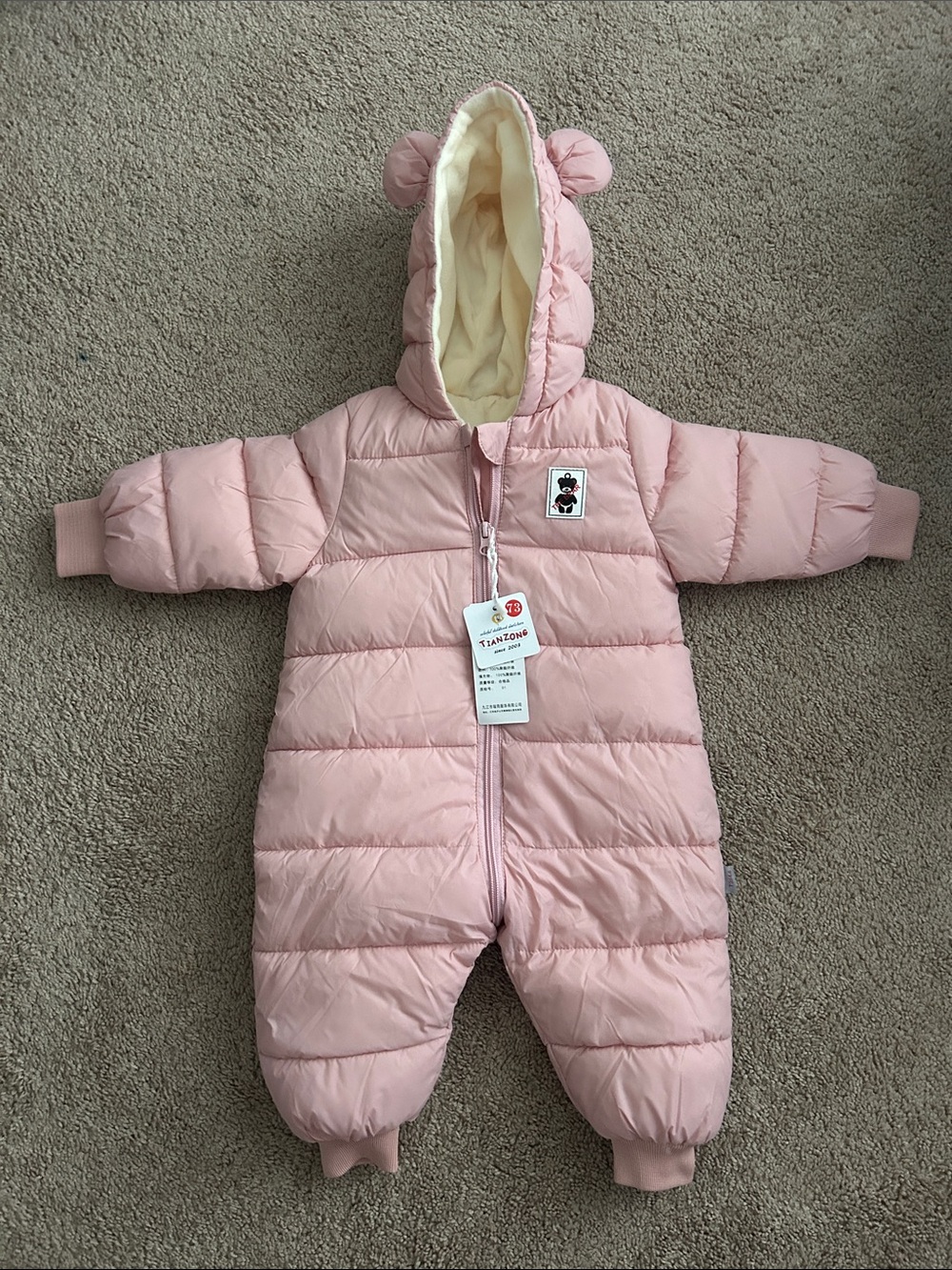 Pink snowsuit for baby 6-12m never worn